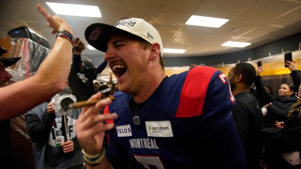 Nov 19, 2023; Hamilton, Ontario, CAN; Montreal Alouettes quarterback Cody Fajardo (7) celebrates with a cigar after winning the 110th Grey Cup against the Winnipeg Blue Bombers at Tim Hortons Field. Mandatory Credit: John E. Sokolowski-USA TODAY Sports